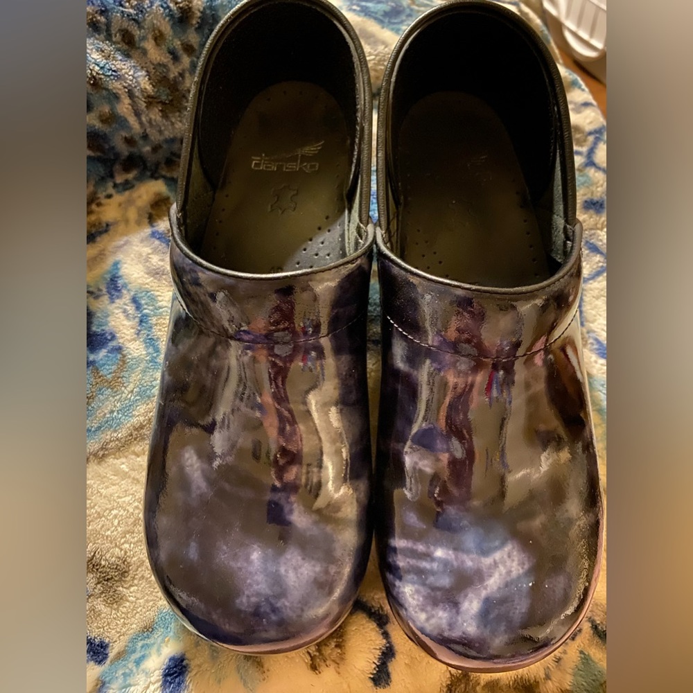DANSKO BLACK with the hint of blue underneath in a soft design .